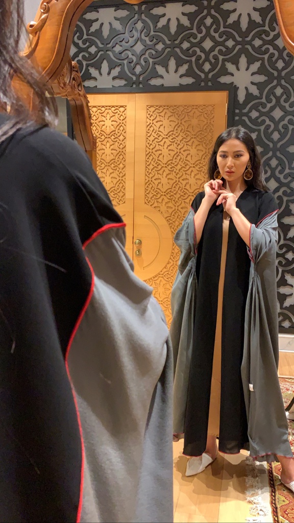 The grey silk pleated abaya with red overlock (Hazm)