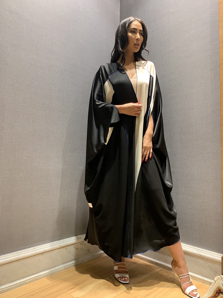 the black and white bisht in blue trim